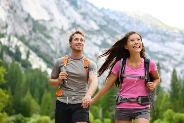 Photo of Happy couple of hikers hiking in Yosemite