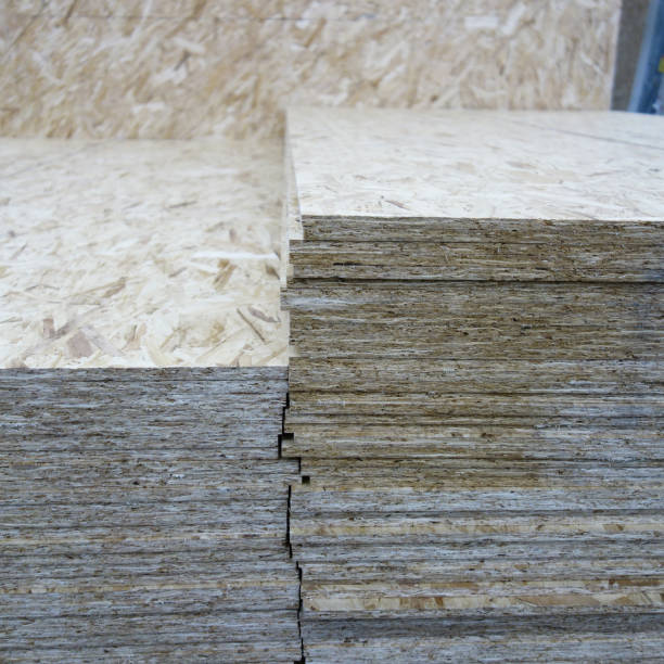 istock OSB background, dense, seamless surface. OSB sheets are stacked in a hardware store. Building material made from brown chips, sanded to a wood background. 1278866992