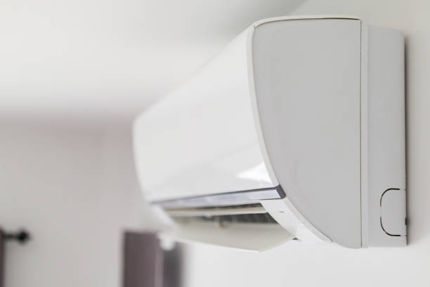 istock Air conditioner on white wall room interior background 1278875464