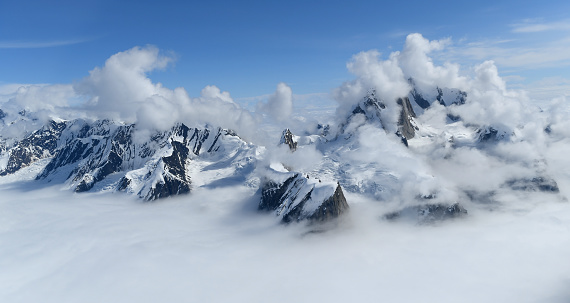 Alaska Range mountains on a sunny, summer day. This part of the range belongs to the Denali National Park.