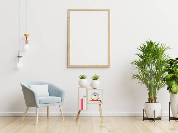 istock Poster mockup with vertical frames on empty white wall in living room interior with blue velvet armchair. 1278877301