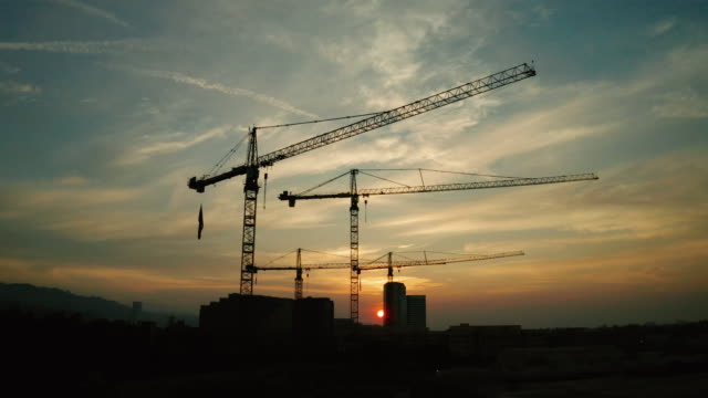 Construction Site - Aerial View of Cranes at Sunset