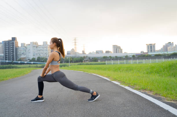 istock A young lady stretching her body outdoor. 1278877434