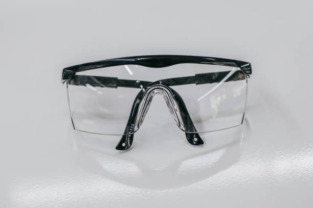 istock Protective Safety eyeglasses. Equipment for work with chemicals. Plastic safety eyewear. Accessory for scientific work and conducting research analysis. 1278880246