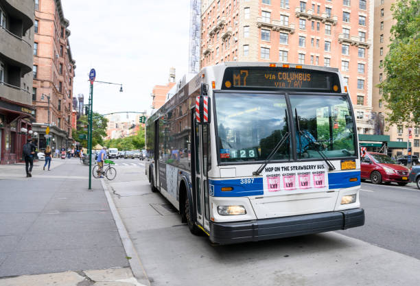 NYC Bus New York, New York, USA - October 5, 2020: The M7 bus on Columbus Avenue on the Upper West Side of Manhattan during the Corona-Virus Pandemic. People can be seen. columbus avenue stock pictures, royalty-free photos & images