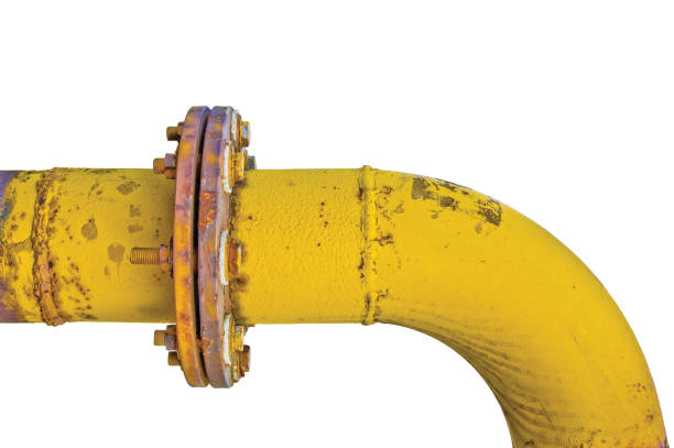 istock Old aged weathered grunge gas pipe connection flange joints, isolated horizontal yellow pipeline curve closeup 1278886680