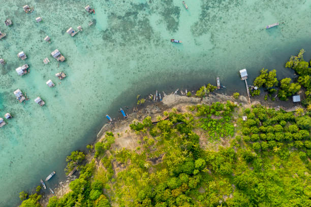 Aerial view of the island around Semporna island with nomadic Sea Gypsy water village, beautiful ocean and coral reef. stock photo