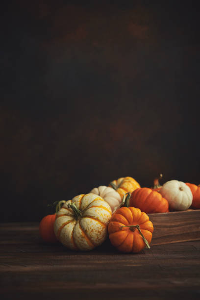 istock Thanksgiving Fall arrangement with pumpkins in harvest crate 1278887503