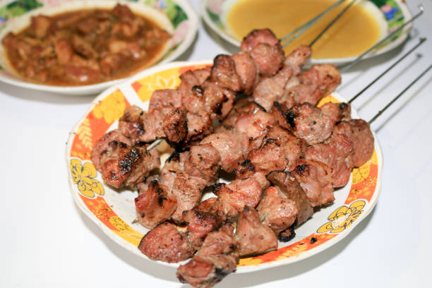 Sate Klathak or Klatak Satay is a unique goat satay or mutton satay dish with steel stick, traditional satay from Yogyakarta, Indonesia. Isolated on white background