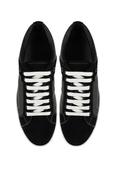istock Black shoes or sneakers close-up 1278890297
