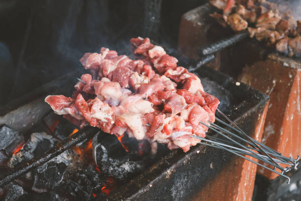 istock Sate Klatak grilling on charcoal grill. Sate klathak is a unique goat satay or mutton satay dish, originally from Yogyakarta, Indonesia. 1278890510