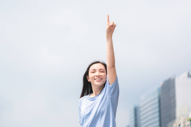 istock Asian woman pointing her finger to confirm 1278892088