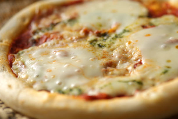 istock Pizza cut into English newspapers 1278893733