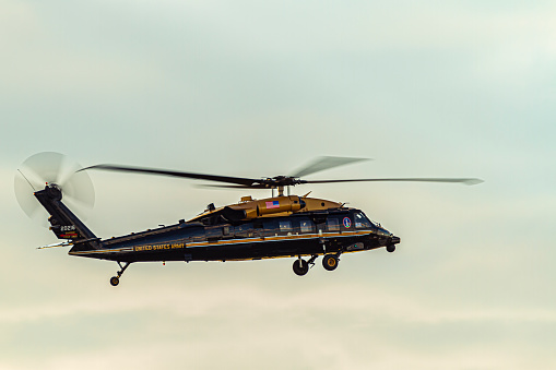 Washington DC, USA 10/03/2020: A Sikorsky VH-60M Golden top Black Hawk (upgraded UH-60M) four blade helicopter belonging to United States Army is in the air. This model is used for executive transport