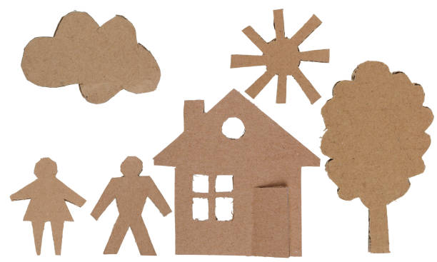Figures of people and objects made of cardboard. Isolated stock photo