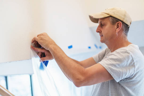 istock Adult Male Using Painter's Tape 1278899989