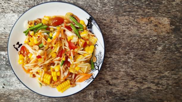 istock Papaya salad with corn and satted egg. 1278909810