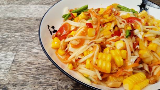 istock Papaya salad with corn and satted egg. 1278910325