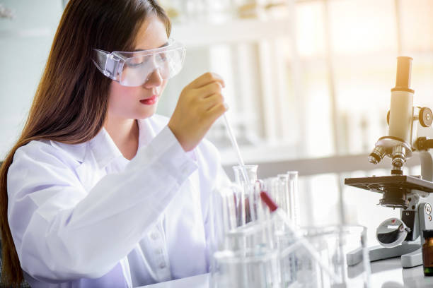 istock Attractive young Asian scientist woman lab technician assistant analyzing sample in test tube at laboratory. Medical, pharmaceutical and scientific research and development concept. 1278910449
