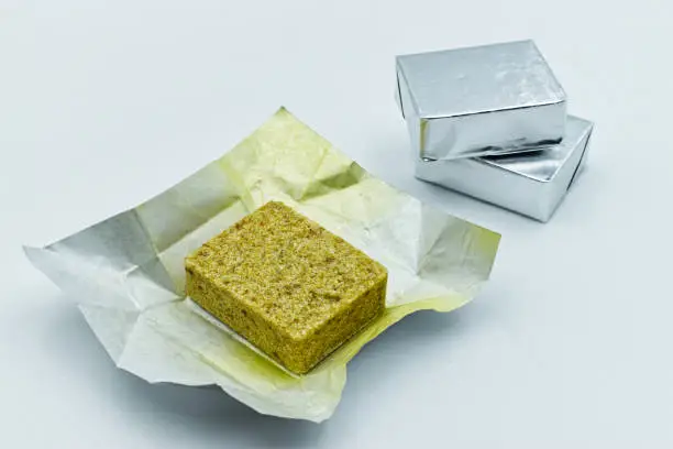 Dehydrated bouillon cubes. Bouillon stock broth cube isolated on white