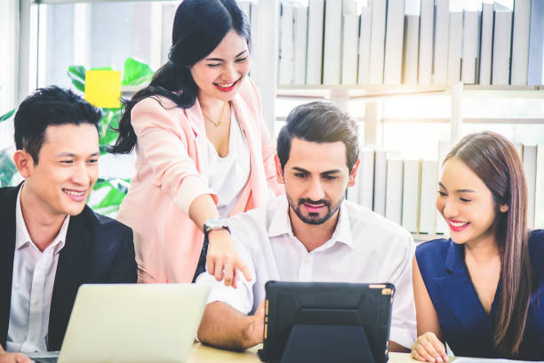 istock Businessman presenting and discussing financial data and analyzing report graph by digital tablet at office. Teamwork meeting and partnership conference working concept. 1278911602