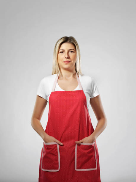 istock Young blonde woman with red apron 1278913618