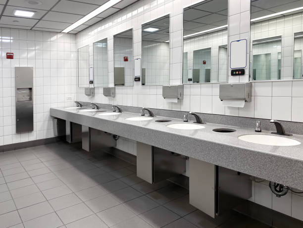 Public restroom Wide angle view of public restroom bathroom bathroom sink sink design stock pictures, royalty-free photos & images