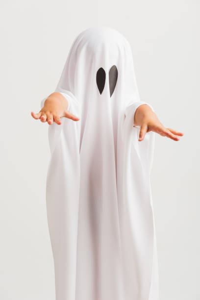 istock little cute child with white dressed costume halloween ghost scary 1278915388