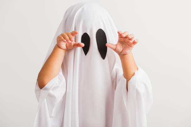 little cute child with white dressed costume halloween ghost scary