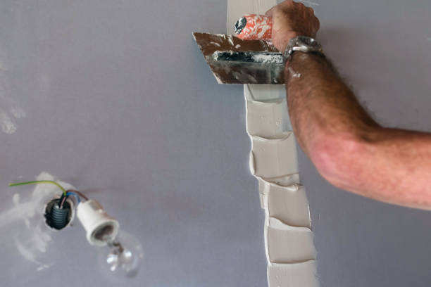 istock plasterer in action in a house 1278916484