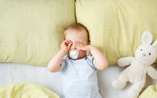 istock One year old baby in the bed 1278916615