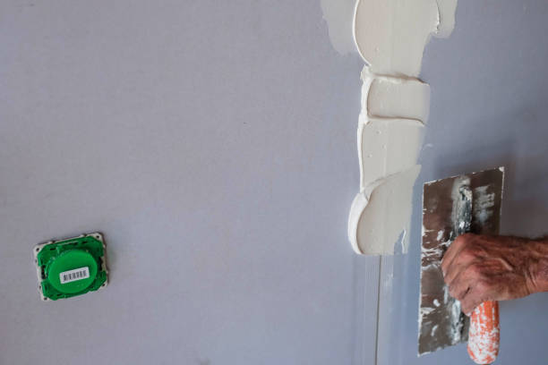 istock plasterer in action in a house 1278916689
