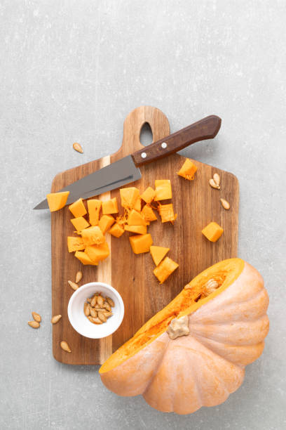 istock Fresh raw sliced butternut squash on wooden board, copy space for text, top down view 1278917568