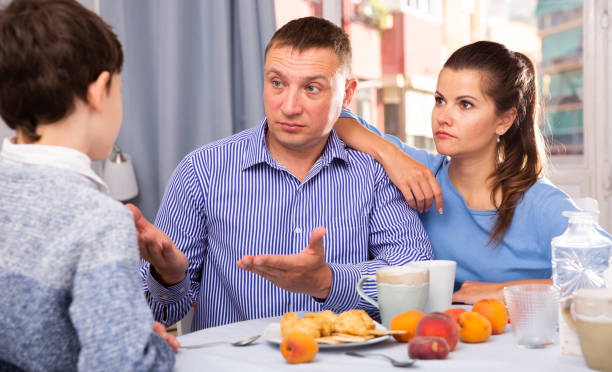 istock Troubled parents reprimanding son 1278917970