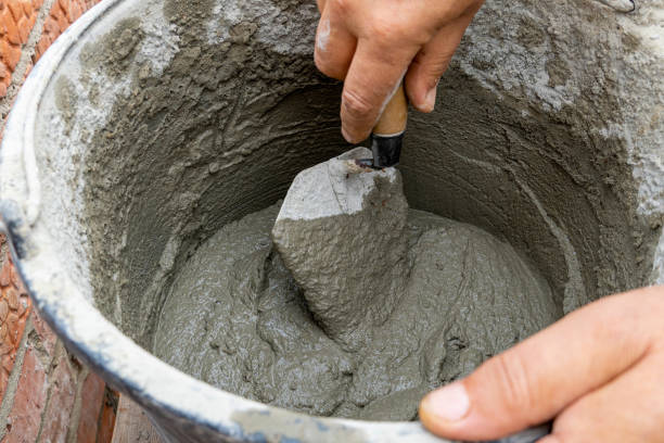 istock Cement-sand concrete mix in a plastic bucket with a trowel 1278920371