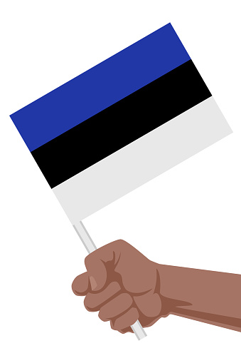 A hand holding flag of Estonia