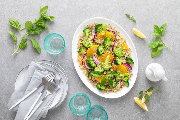 istock Vegan quinoa and broccoli warm salad with oranges and fresh onion, top down view 1278921785
