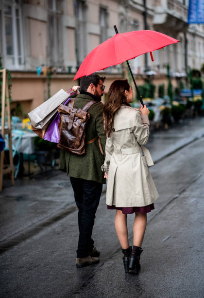istock Young couple walking down the street 1278923889