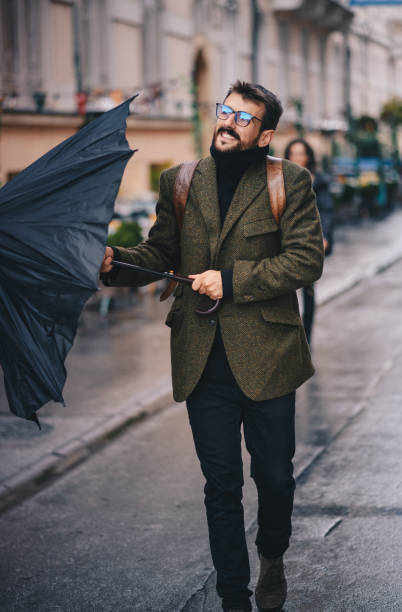 istock Young man opening umbrella 1278924098