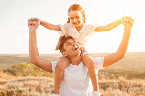 istock Excited father carrying daughter on neck 1278927855