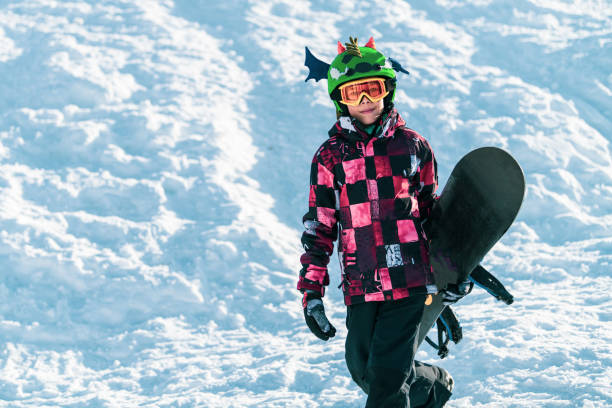 istock Portrait Of Boy With Snowboard 1278929920