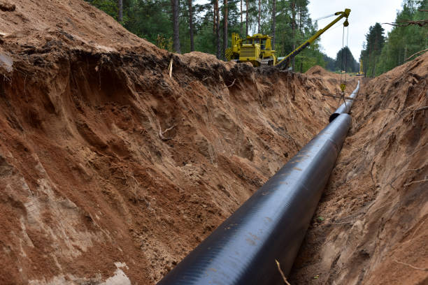 istock Natural gas pipeline construction work in forest area. 1278930219