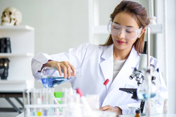 istock Attractive happiness scientist lab technician assistant analyzing sample in test tube at laboratory. Medical, pharmaceutical and scientific research and development concept. 1278932243