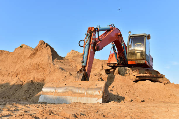 istock Bucket wheel excavator on earthmoving. Backhoe digs sand on blue sky background 1278933625