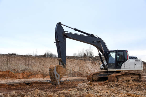 istock Excavator working on earthmoving at open pit mining. Backhoe digs sand and gravel in quarry 1278933882