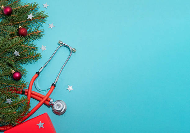 istock Phonendoscope with Christmas decorations on a blue background. Banner with space for text. Congratulations to medical workers on the New year. 1278937128