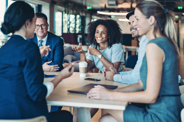 istock Group of business persons talking around the table 1278937757