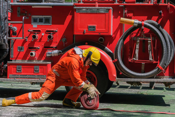 istock Firefighters and Fire hose coil  fire and rescue training school regularly to get ready - help, fire protection concept 1278940104