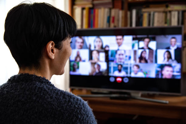 istock Woman in front of a device screen in video conference for work 1278940448