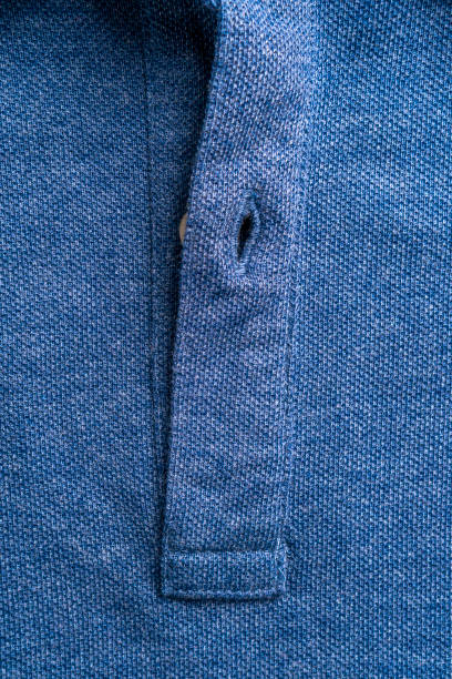 istock Closure of a blue polo shirt with a button 1278940662